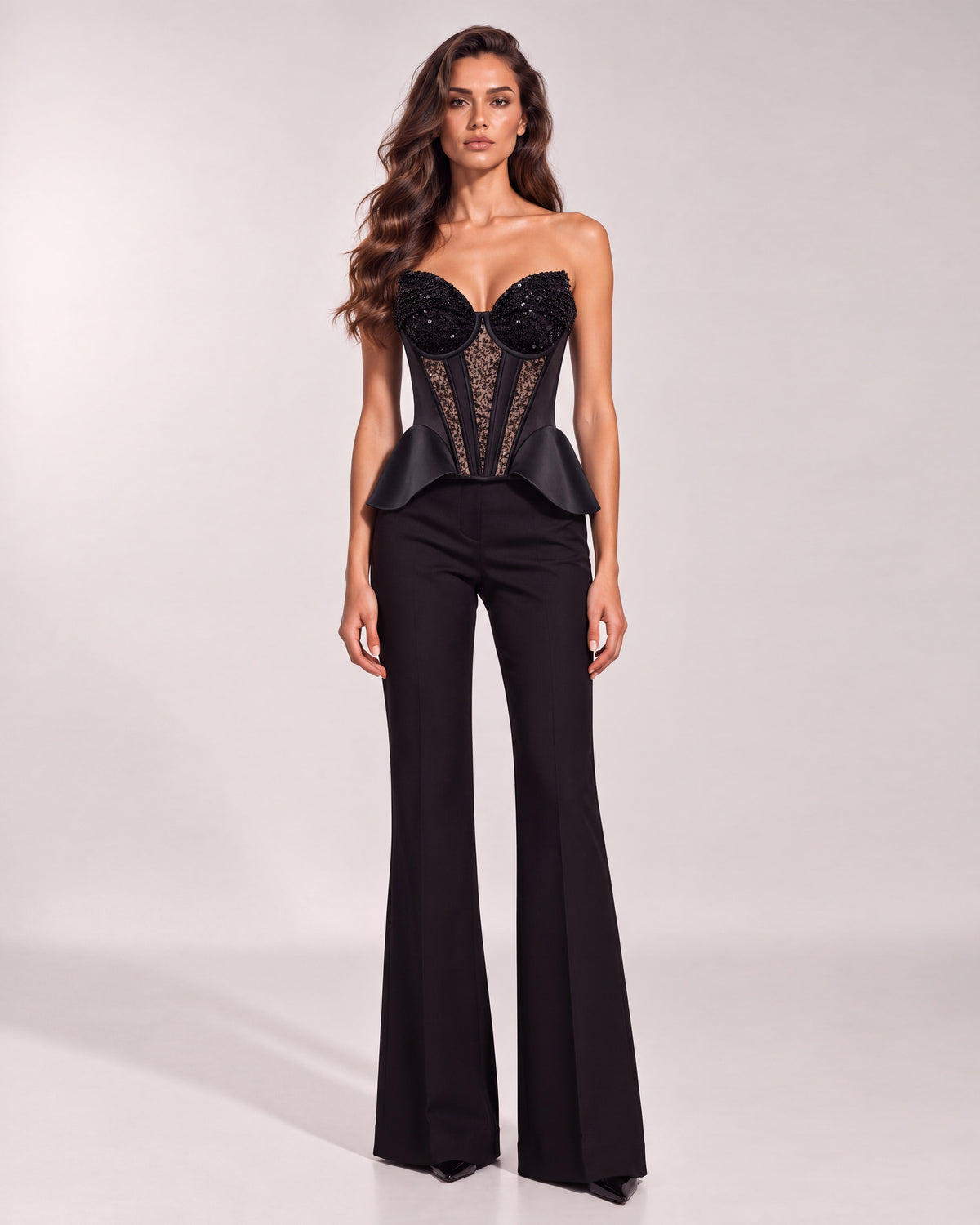 Black flared trousers styled on a model